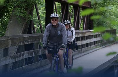 Couple biking on Menomonie bike trails.